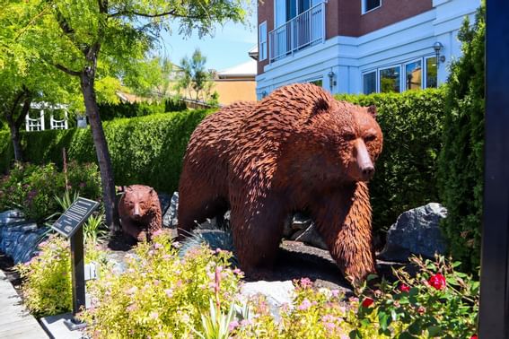A bear statue in the garden at Manteo Resort Waterfront
