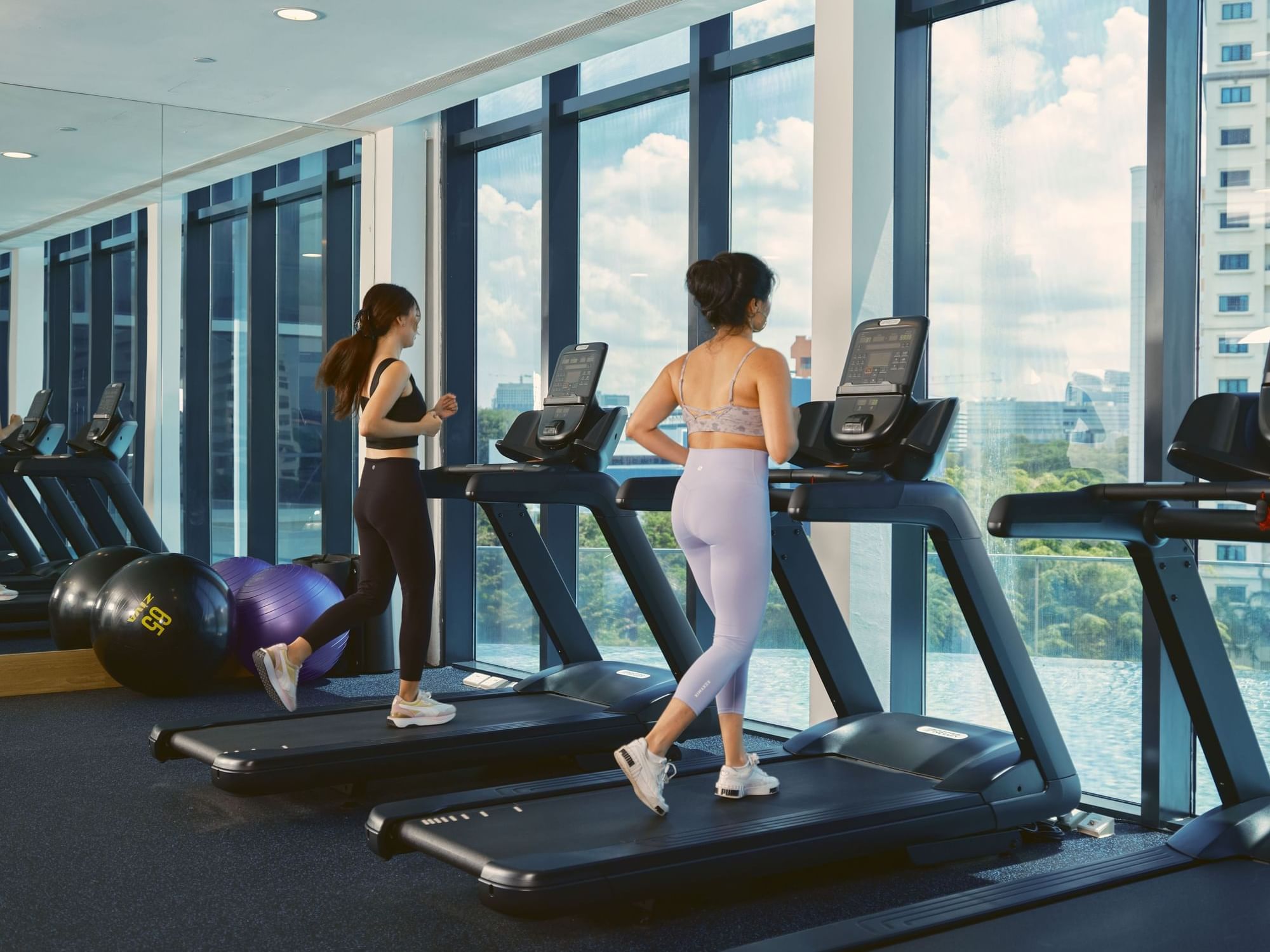 2 women running on treadmills in Gym, Momentus Hotel Alexandra