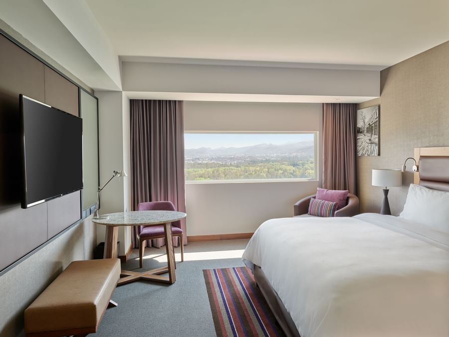 King bed, TV in hill view Deluxe room at FA San Luis Potosí