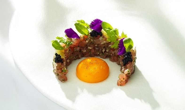 Tuna tart served with an egg yolk in Whitcomb's restaurant at The Londoner