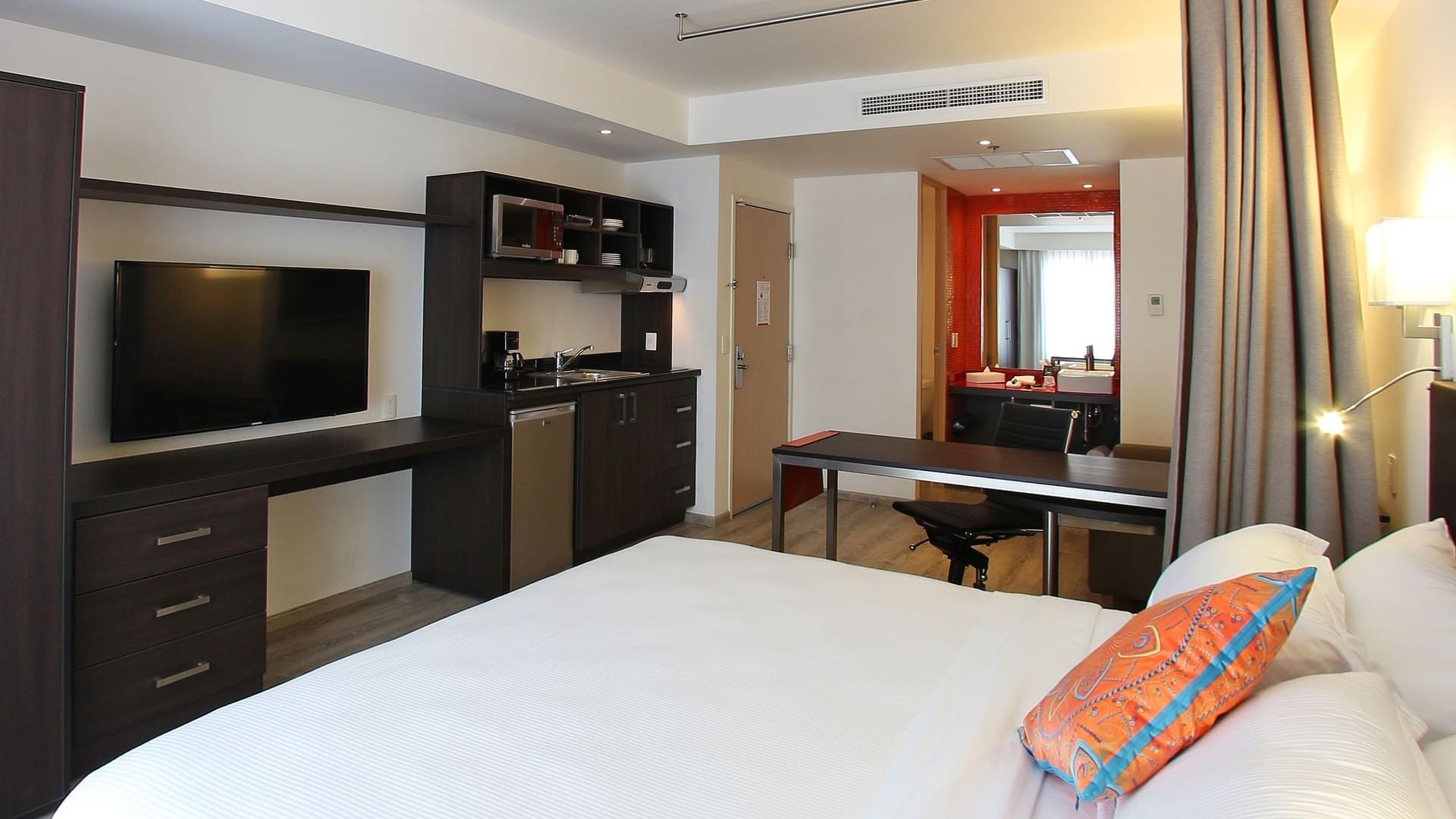 Interior of Loft room with TV at Fiesta Inn Querétaro