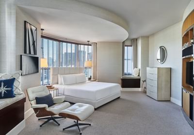 A window lounge by the king bed & arm chair in Presidential Suite at Hotel Republic San Diego