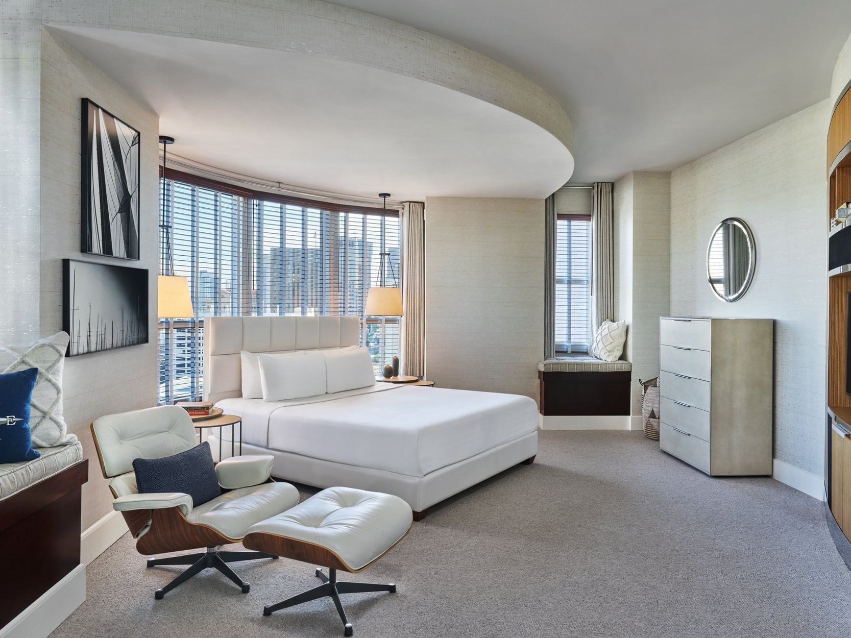 A window lounge by the king bed & arm chair in Presidential Suite at Hotel Republic San Diego