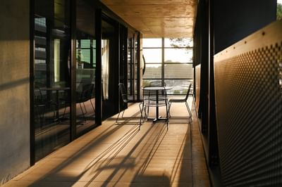Dining table by a window at Nesuto Curtin Perth Hotel