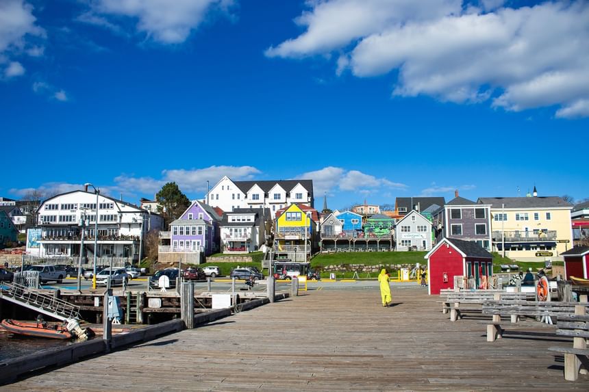 Scenic waterfront pier and colorful buildings near Rodd Grand Yarmouth, one of best hotels in Yarmouth, Nova Scotia