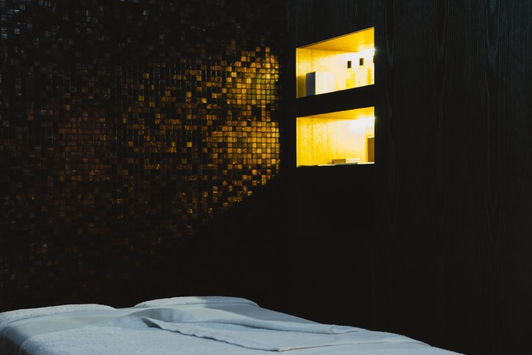 Spa bed with spa amenities featuring wellness hotel Barcelona at Almanac Barcelona