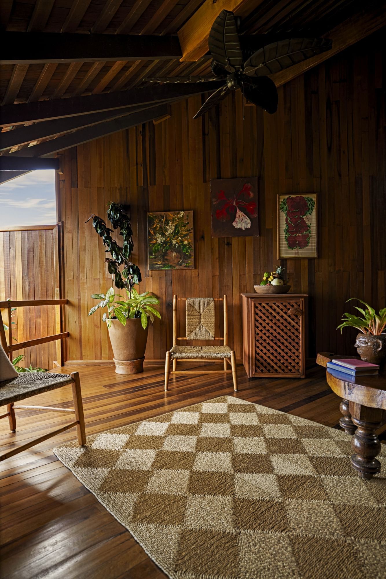 Plant vase and chairs stands on carpeted wooden floor in Heritage Suites at Ladera Resort