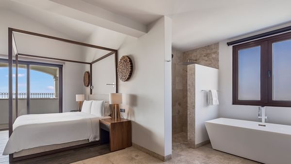 King bed & bathtub in Two Bedroom Residence at Live Aqua Resorts