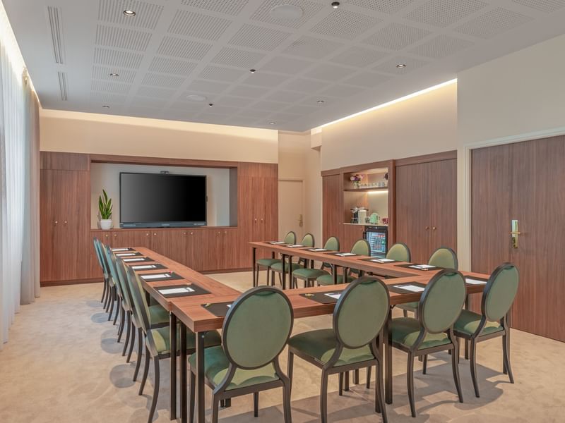 U Shape table set-up with TV in Westminster at Warwick Hotels and Resorts