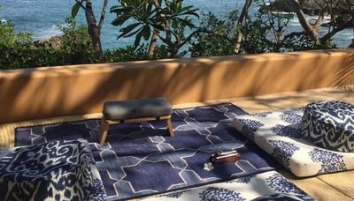 Mat & cushions for outdoor meditation at Cala de Mar