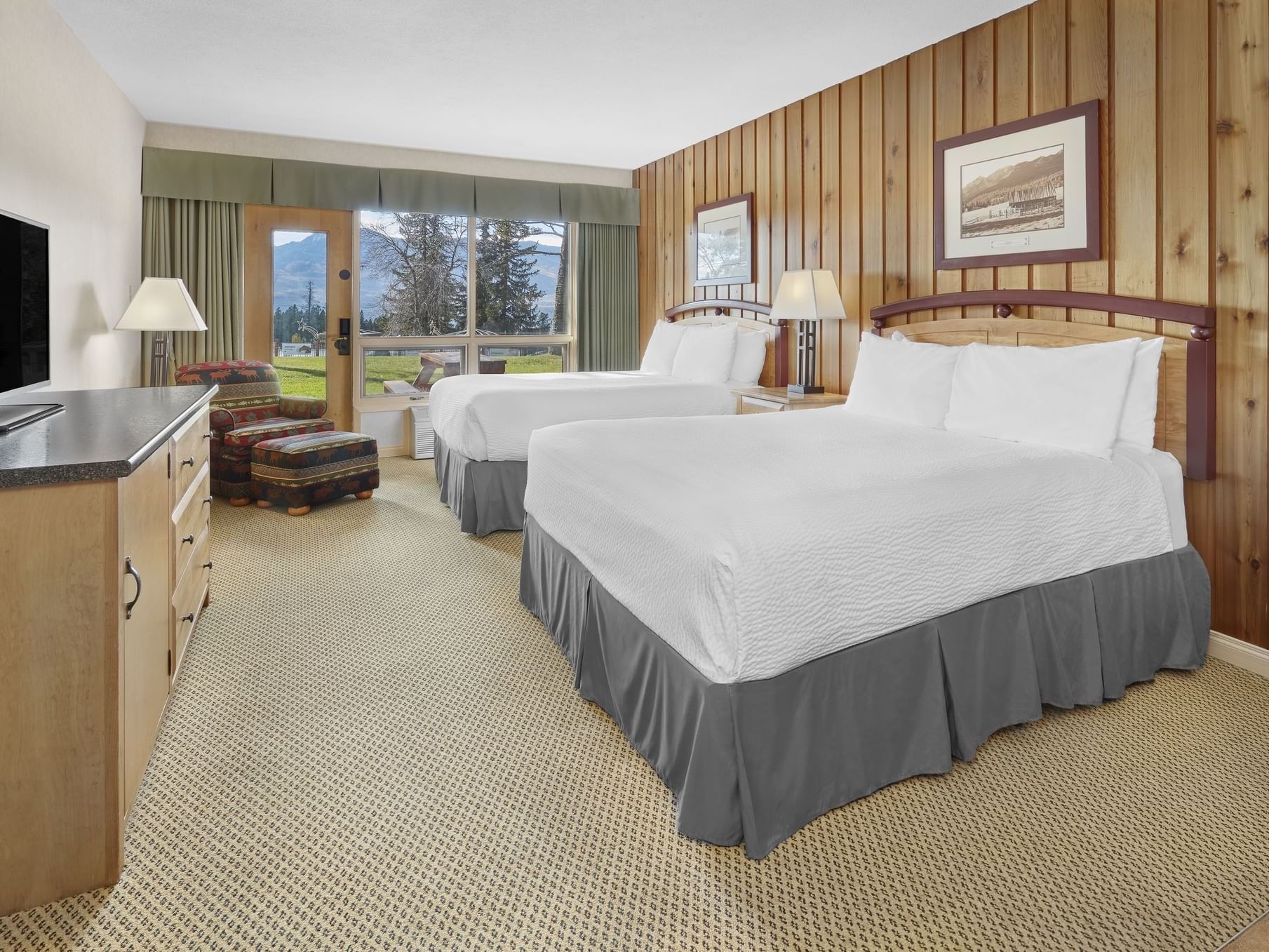 Classic 2 Connecting Bedrooms with cozy beds and a TV at Fairmont Hot Springs Resort