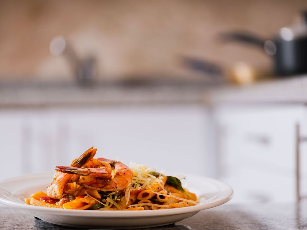 Prawn pasta dish served in a room at FA Hotels & Resorts