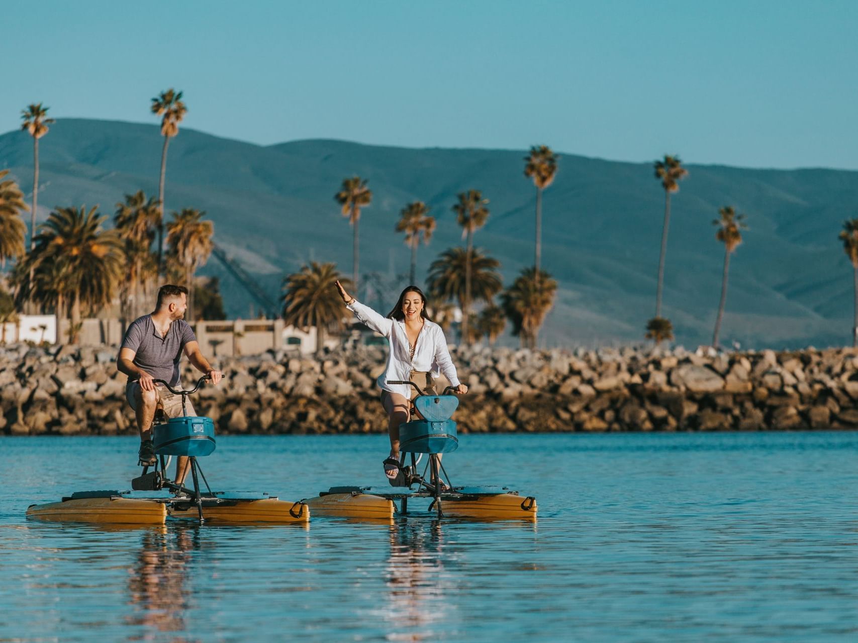 Couple engaged in water sports at Hotel Coral y Marina