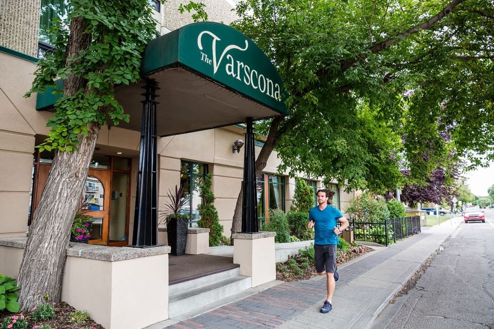Man jogging past the hotel entrance at Varscona Hotel on Whyte
