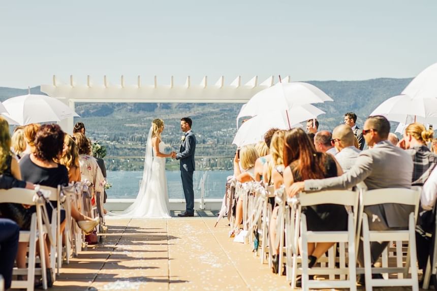 A wedding ceremony with a lake view at Hotel Eldorado