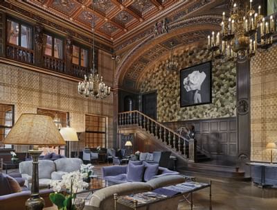 Lobby living area with stairs at Patrick Hellman Schlosshotel