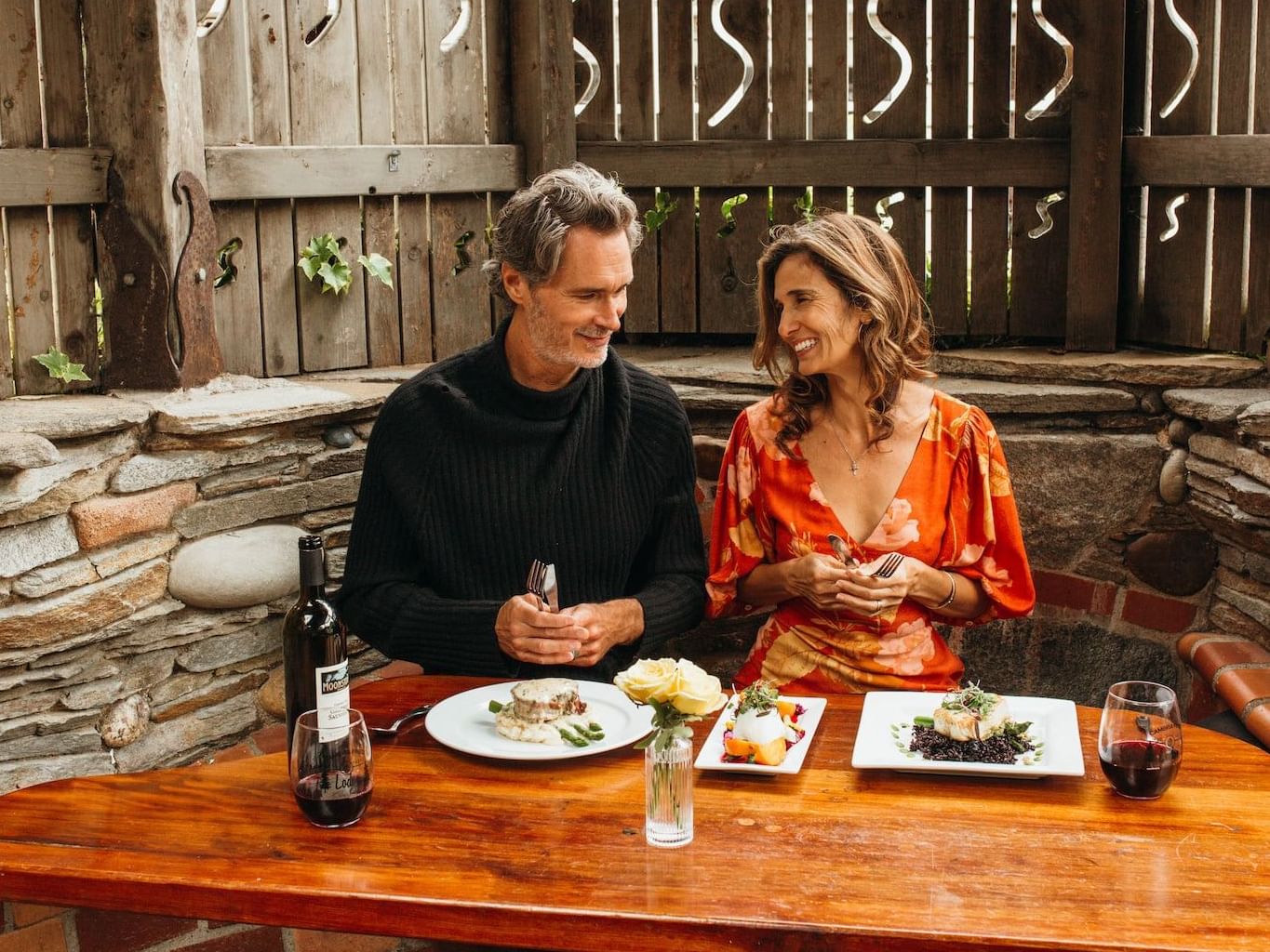 Couple enjoying a meal in the outdoor dining area