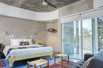 The Solana bedroom with a King Bed at El Blok Hotel