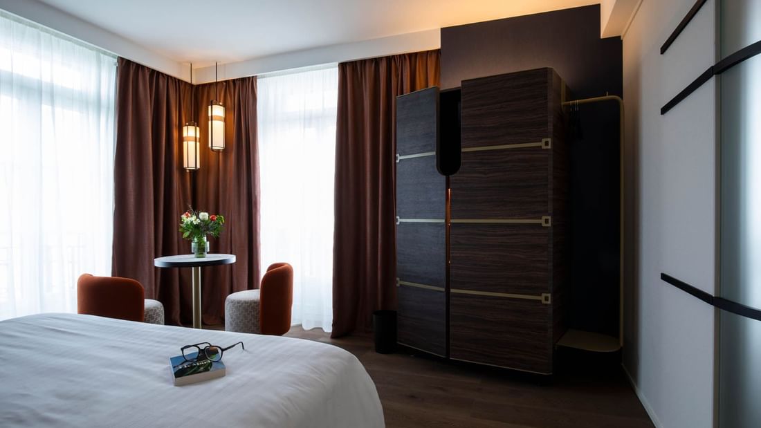 Cupboard, desk & bed in Privilege Room at Oceania Hotels Group