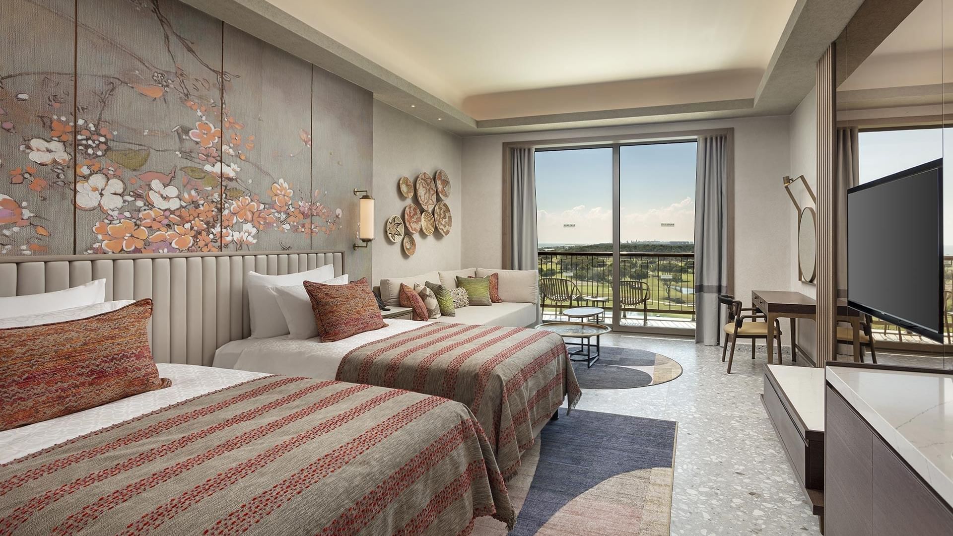 TV & work desk & seating area by the beds in Superior Room Golf View at Cullinan Belek