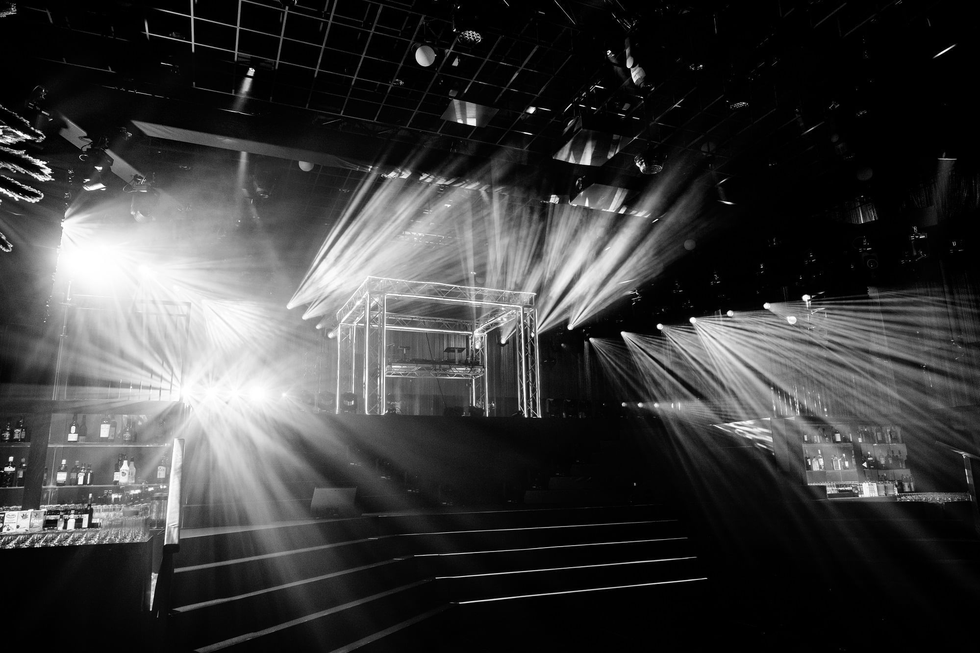 Stage with white spot lights and a large auditorium at The Londoner Hotel