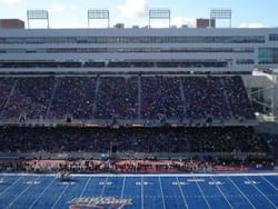 An overcrowd watching a live performance in Albertsons Stadium near Hotel 43