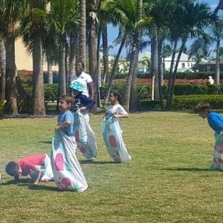 Kids engaging in Sack race at The Somerset on Grace Bay