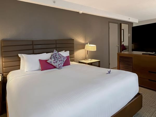 Bed and tv in a hotel room