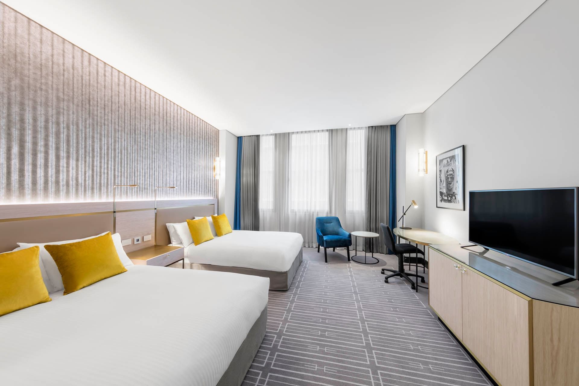 Premier Twin Room featuring two twin beds, a work desk, and TV at Paradox Sydney hotel accommodation in sydney