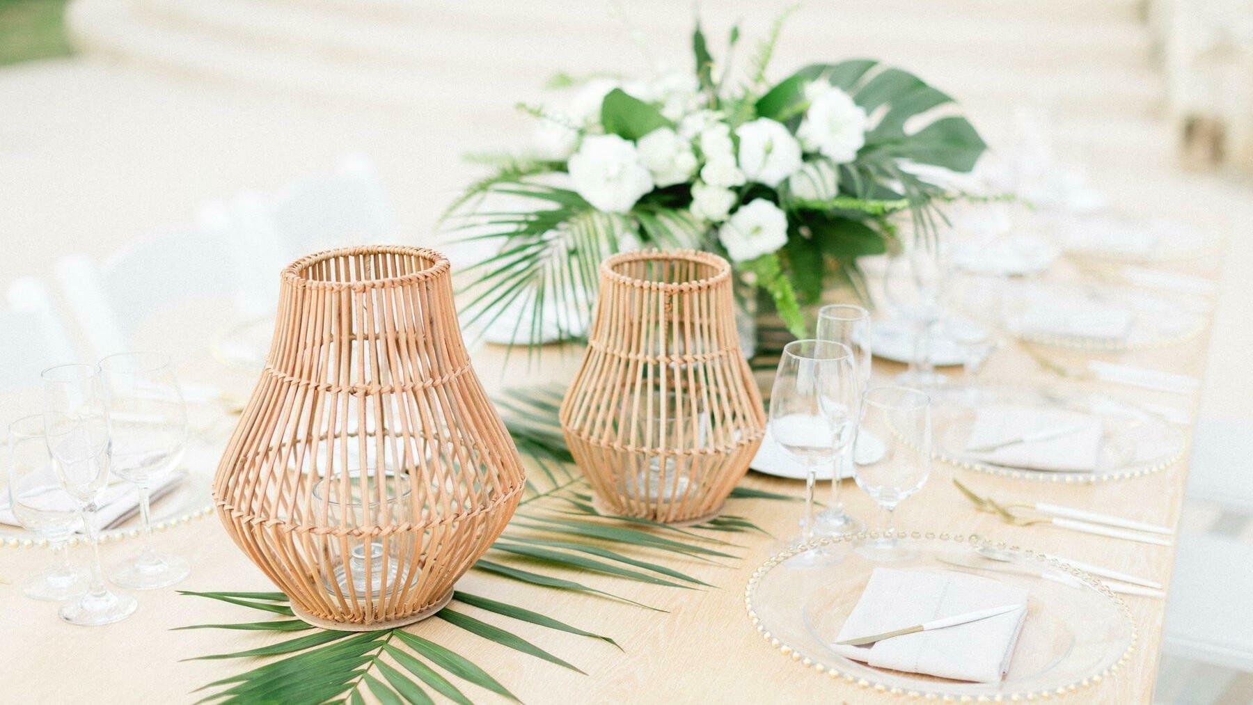 Candle lamps with plates on a table at FA Puerto Vallarta