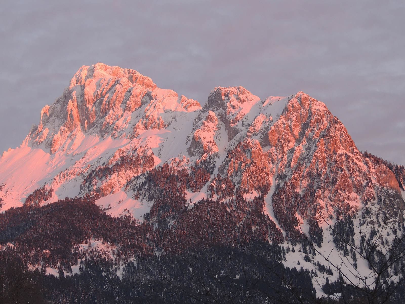 Sunset Light Reflected on Snowy Mountains near Hotel Les Gentian
