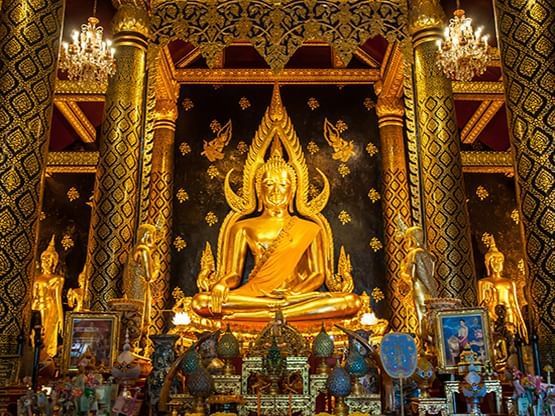 Golden Gautama Buddha statue in Phra Si Rattana Mahathat temple near Hop Inn Hotel