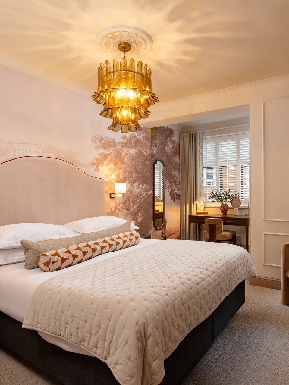 Elegant one bedroom apartment interior at The Capital Hotel in London with king bed and modern decor