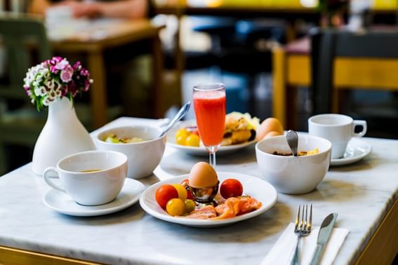 Breakfast arranged with cereal bowl, fruits tea and juice at Park Hotel Hong Kong