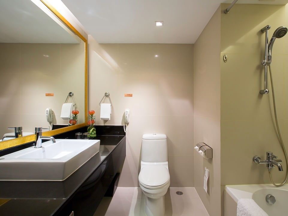 The bathroom in Deluxe Room at Eastin Hotels Makkasan Bangkok