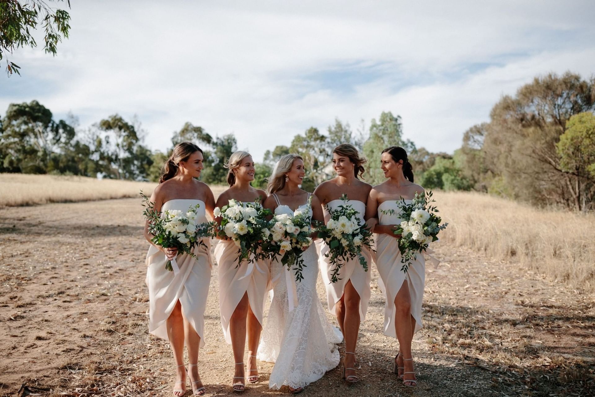 Bride with bridesmaids in elegant dresses at Novotel Barossa