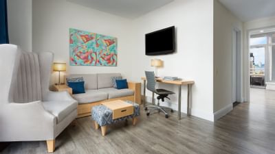 a couch and chair in a hotel room