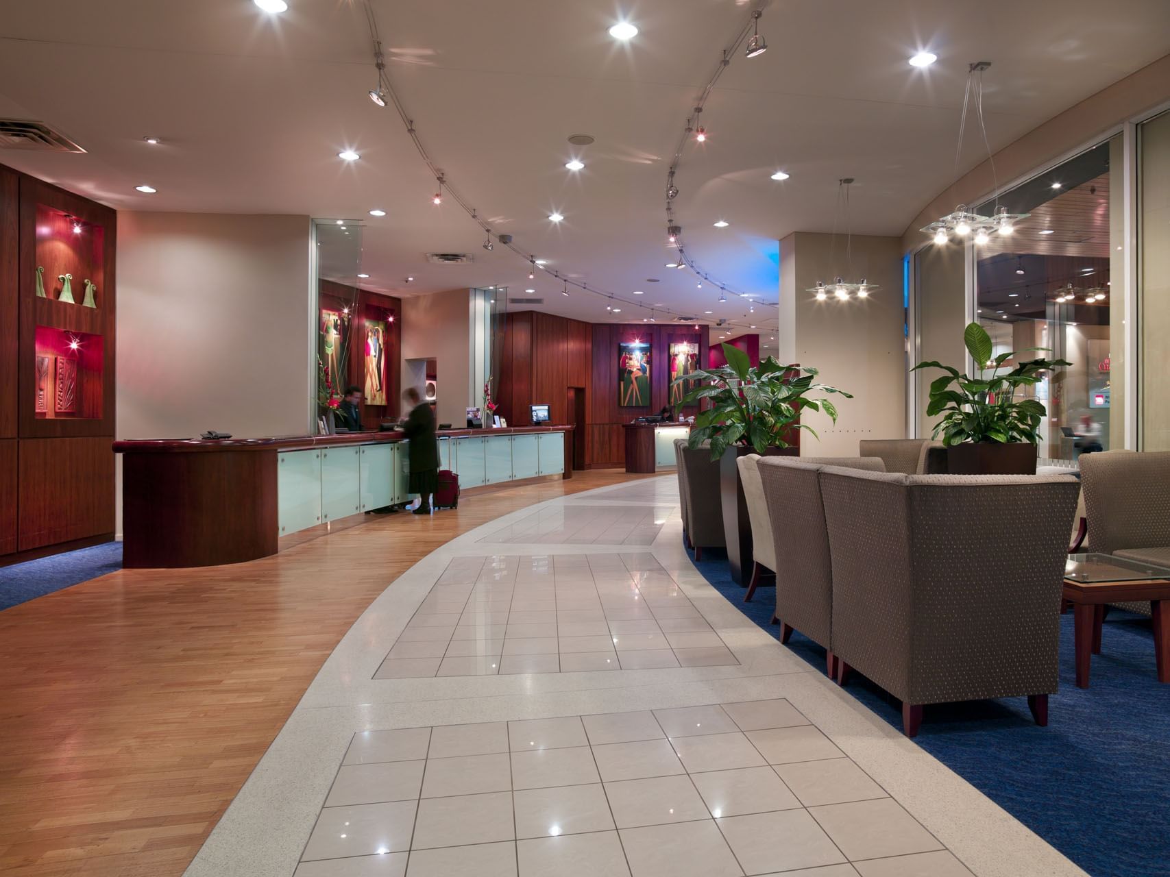 Illuminated lobby lounge area by the front desk at James Cook Grand Chancellor