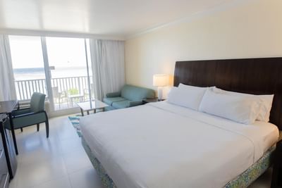 Double bed & furniture in a room at Holiday Inn Montego Bay