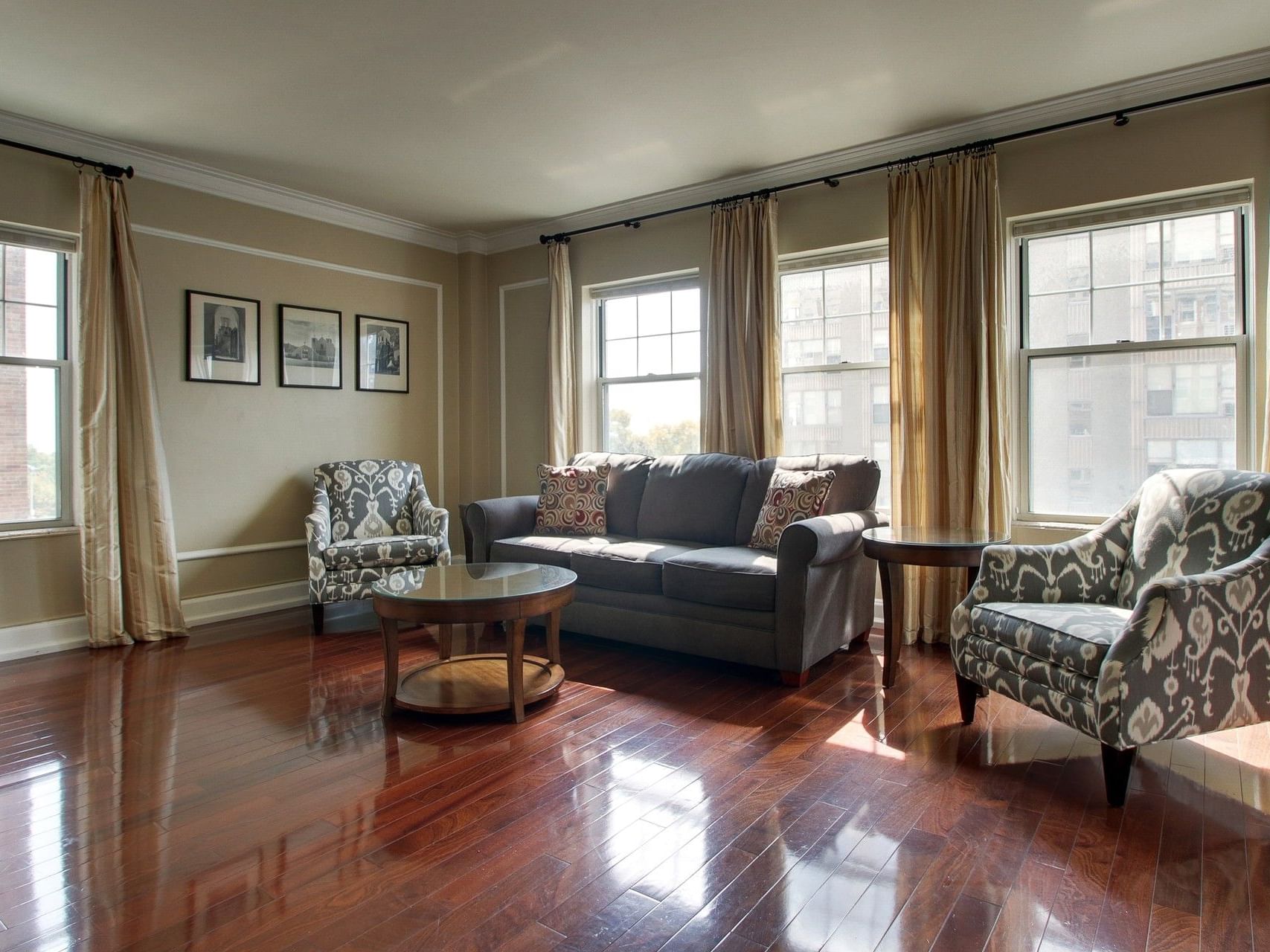 Living area with a sofa & wooden floors in Two Bedroom Suite at Knickerbocker On The Lake, featuring Milwaukee hotel deals