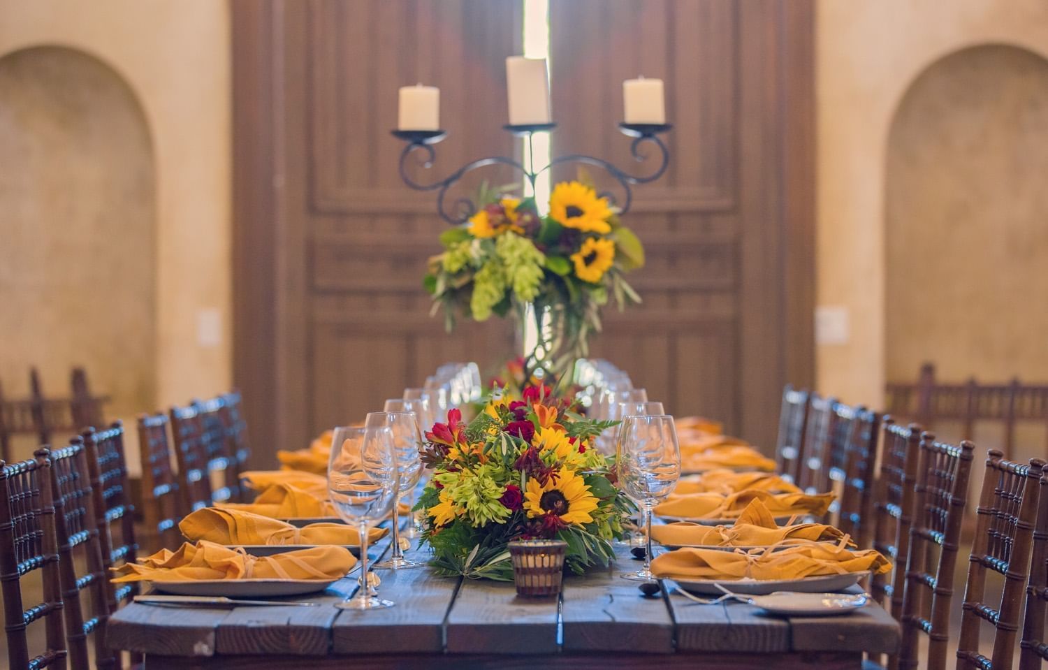 Private dining room area with sunflower center pieces at Allegre
