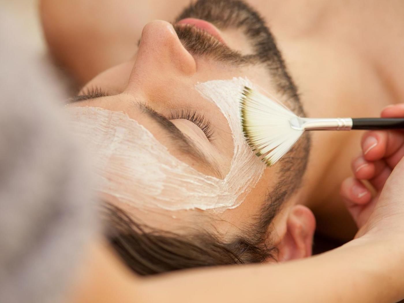 Close-up of a man getting facial treatments at FA Hotels