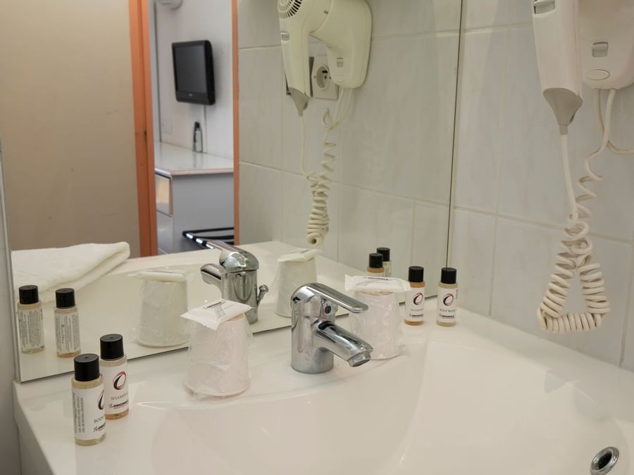 Bathroom vanity in bedrooms at Relax'Otel