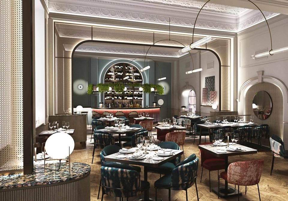 Luxurious Gott's Bar & Kitchen at The Met Hotel Leeds, England, with a central counter and elegant contemporary furnishings