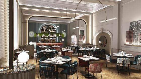 Luxurious Gott's Bar & Kitchen at The Met Hotel Leeds, England, with a central counter and elegant contemporary furnishings