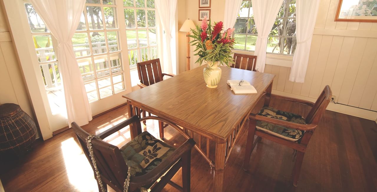 Table, chairs, and vase