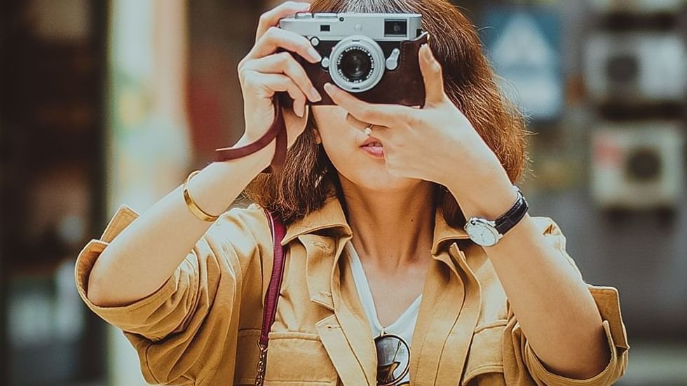 Woman taking a photo with a camera near Falkensteiner Hotel Belgrade