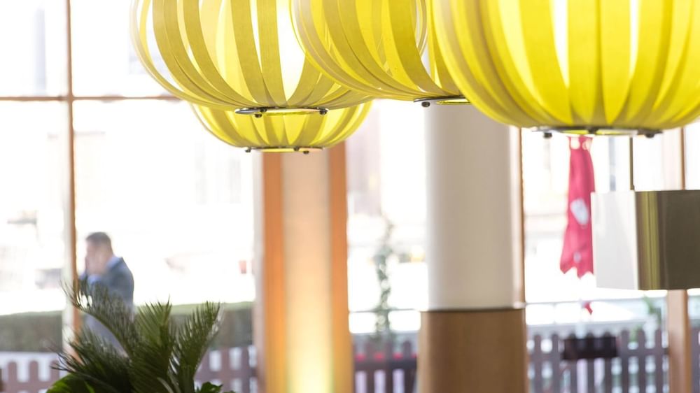 Bright yellow hanging lamps creating a modern ambiance in Events by The Ternary at Novotel Sydney on Darling Harbour