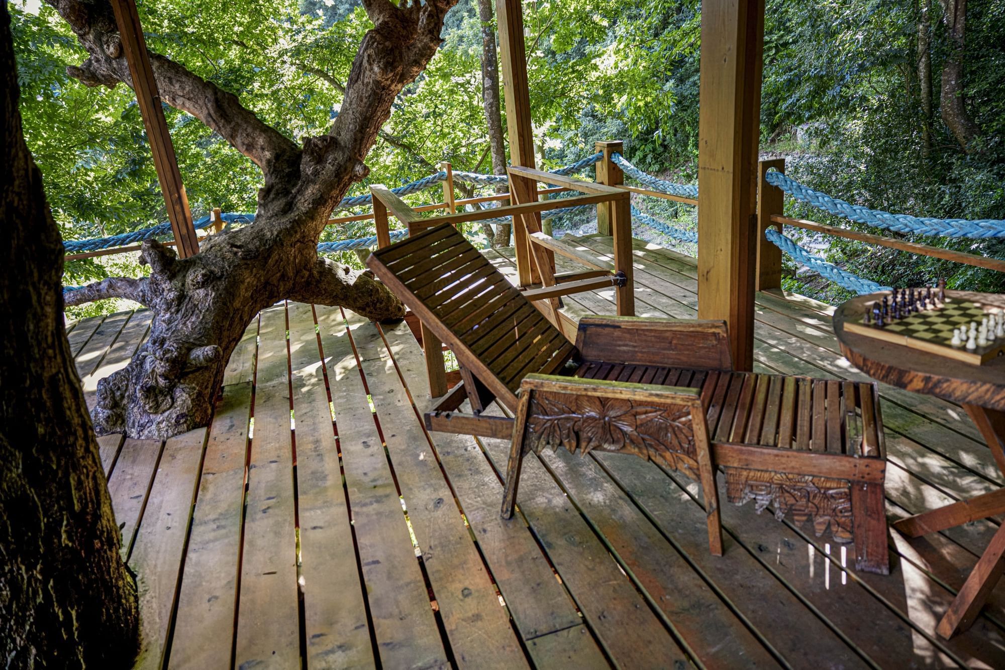 Wooden chair arranged on a wooden deck in Tree House at Ladera St lucia