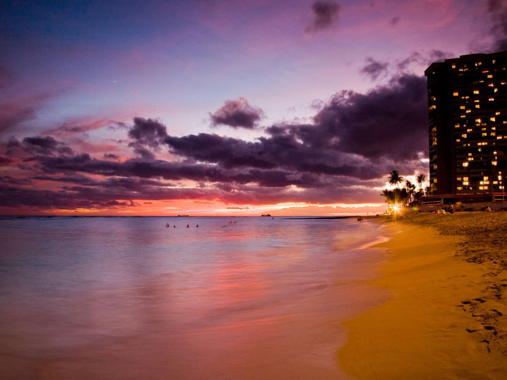 Landscape view of the beach at sunset near Stay Hotel Waikiki